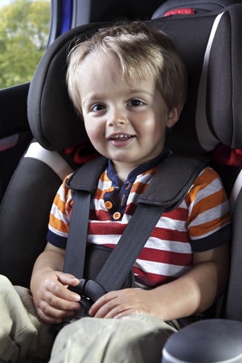 Baby boy in his child safety car seat