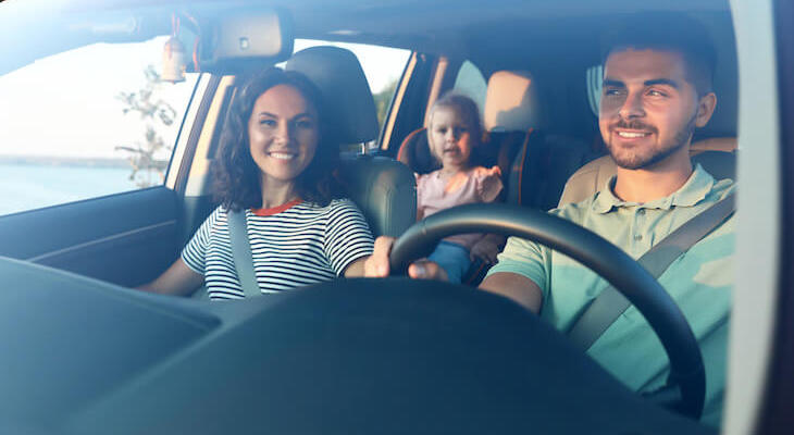 Infinity auto insurance: happy family in their car