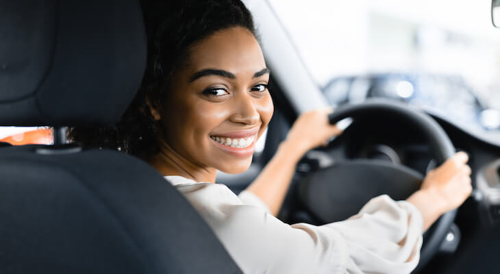GEICS: woman happily driving