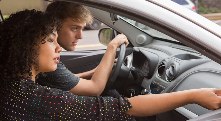 Car insurance for college students: couple in their car