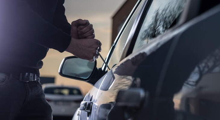 Does car insurance cover theft: thief stealing a car