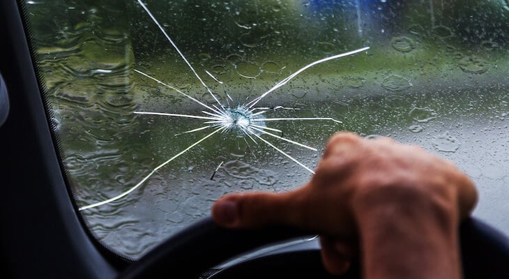 Windshield replacement insurance: close up shot of a broken windshield