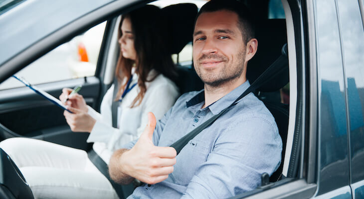 Car insurance history: man doing the thumbs up