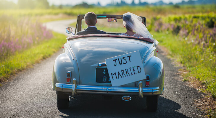 Car insurance for married couples: newly weds driving away