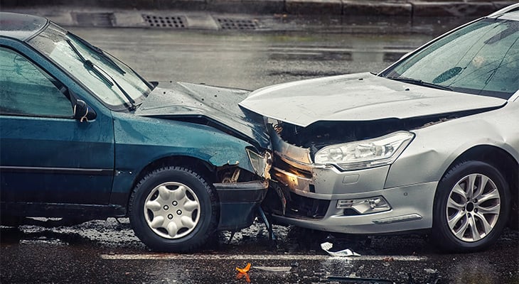 a two-car crash on a wet road