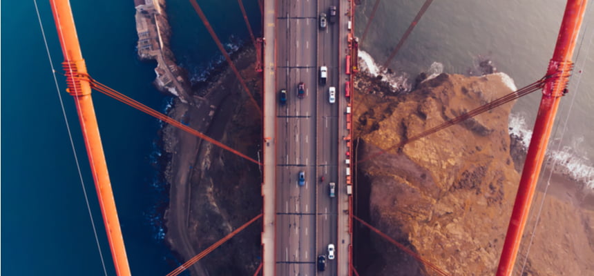 Cars with cheap insurance driving over the Golden Gate Bridge in California