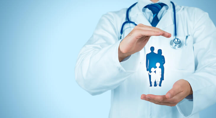 doctor holding hands over graphic of a family
