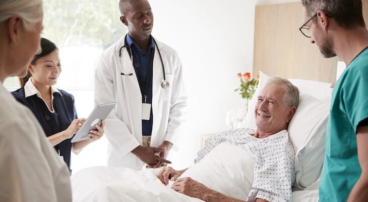 How much does a colonoscopy cost: medical team talking to an elderly patient