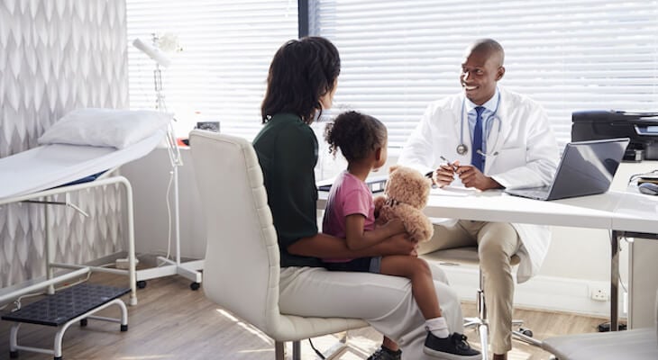 Alternatives to health insurance: mother and daughter consulting a doctor