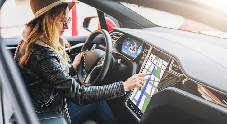 Woman using Tesla navigation system