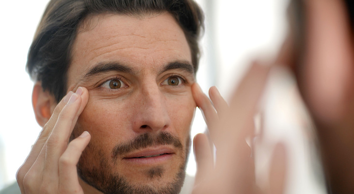 Botox cost: man looking at his wrinkles
