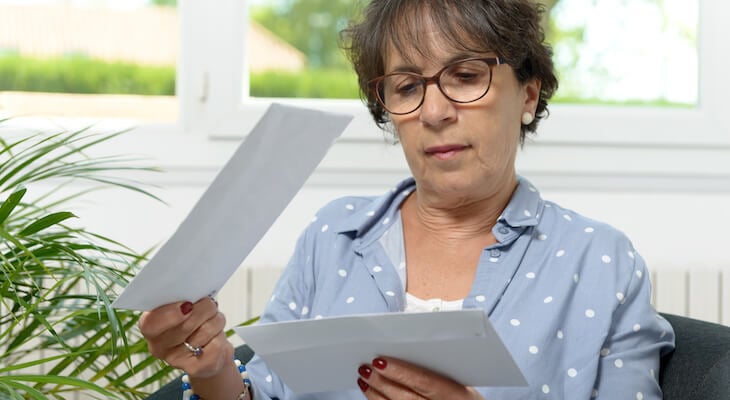 Reduce healthcare costs: person checking their mail