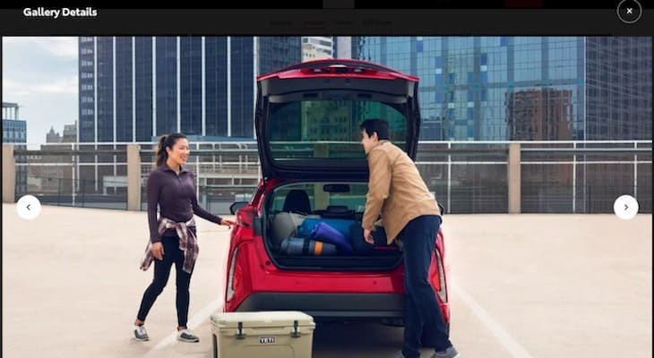 Toyota Prius Prime: couple loading things into their car's trunk