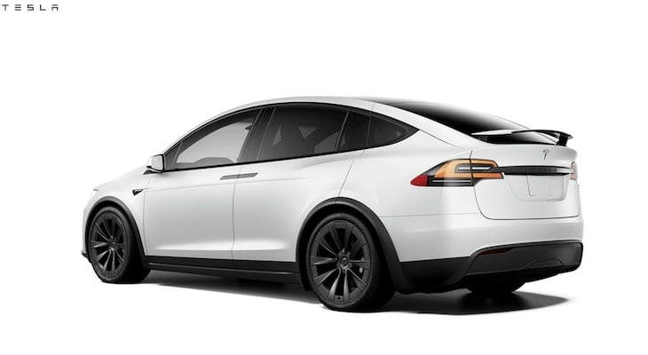 Audi e tron vs Tesla: white Tesla