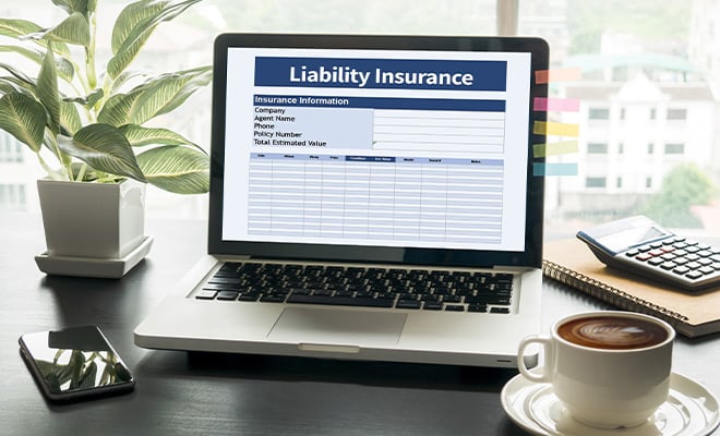 Liability insurance document on laptop