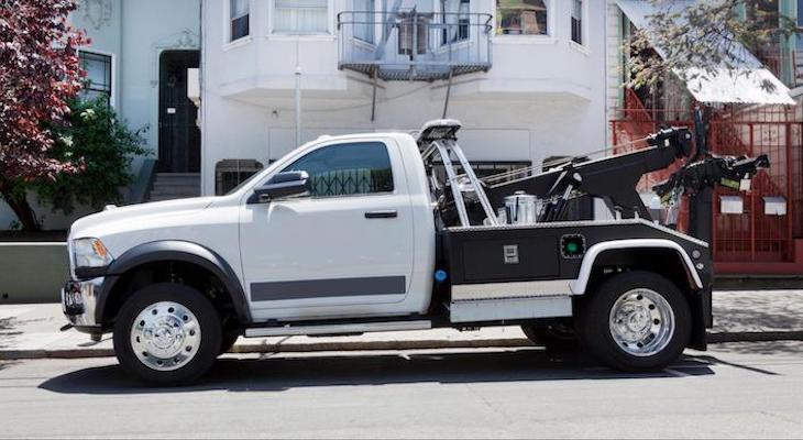 Tesla roadside assistance: towing pickup truck parked outside