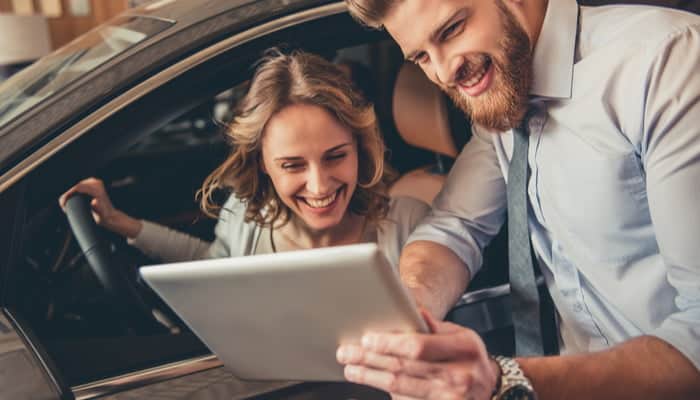 man and woman asking common auto insurance questions