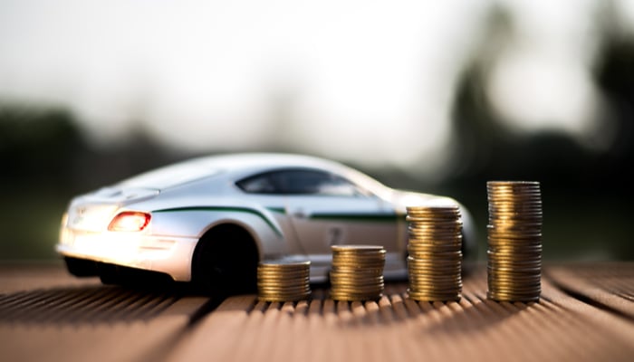toy car and coins representing finding affordable car insurance