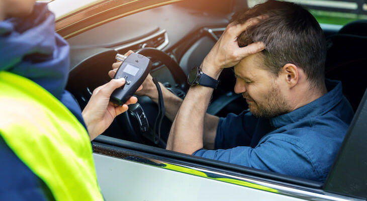 Police testing an upset driver using an alcometer, how will he get the best insurance with DUI