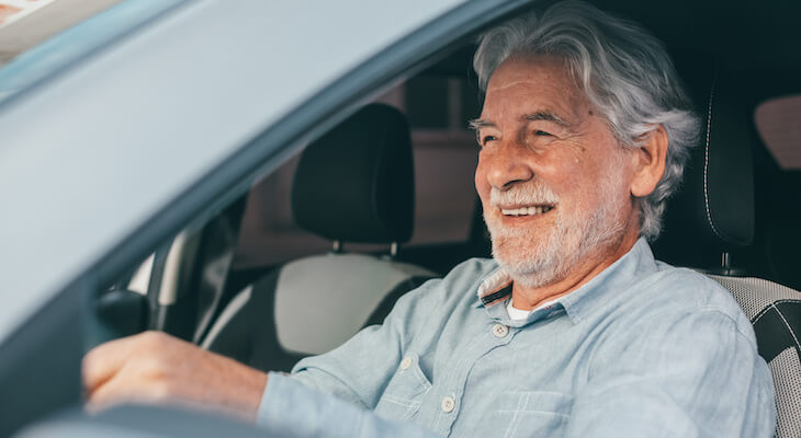 Senior driver happy with the best car insurance with bad credit