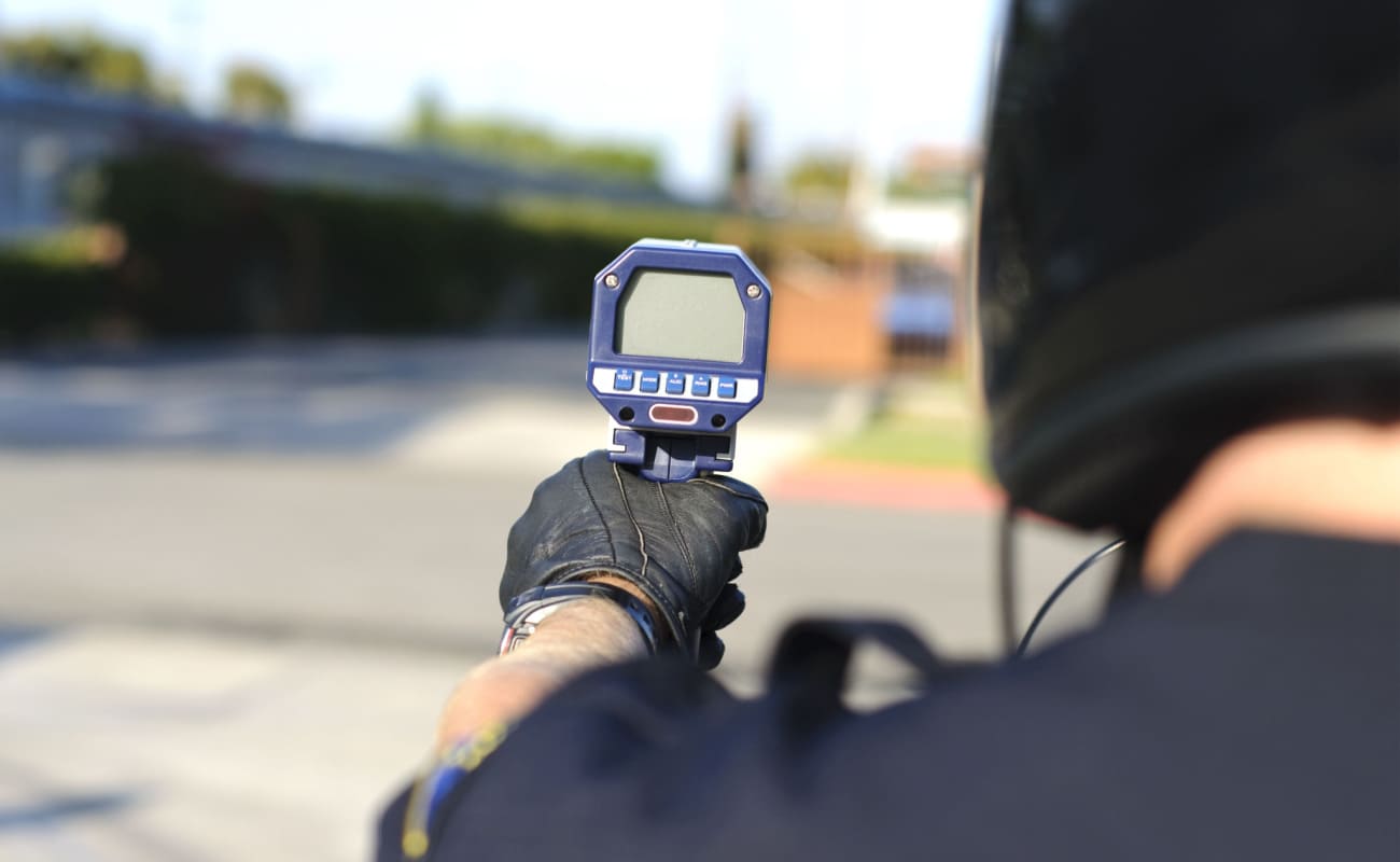  police officer tracking speeding cars 