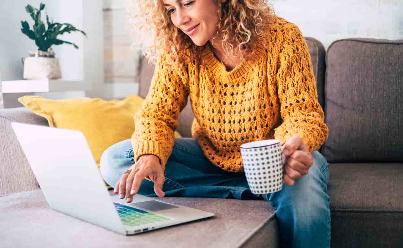 woman on computer researching how to save on car insurance 