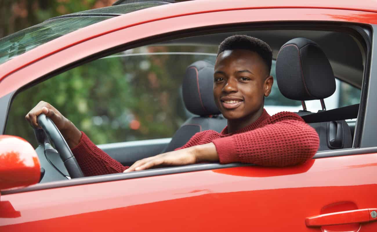young teenage driver behind the wheel