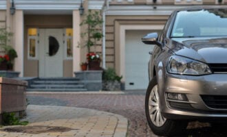 Homeowner auto insurance: car parked in front of a house