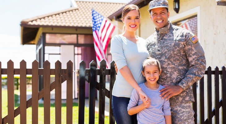 GEICO military discount: family outside of their their house