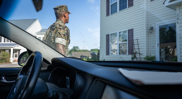 military member getting out of car