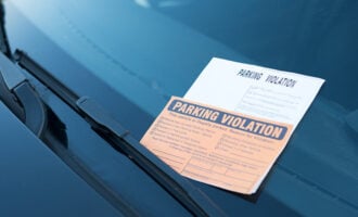 parking ticket left on car's windshield