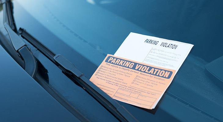 parking ticket on car windshield