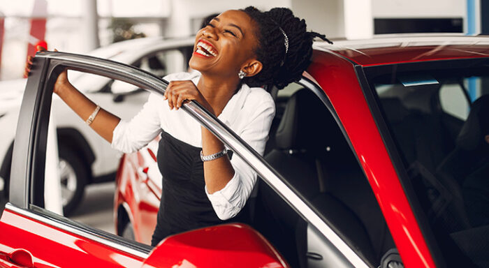 Woman excited about used car purchase