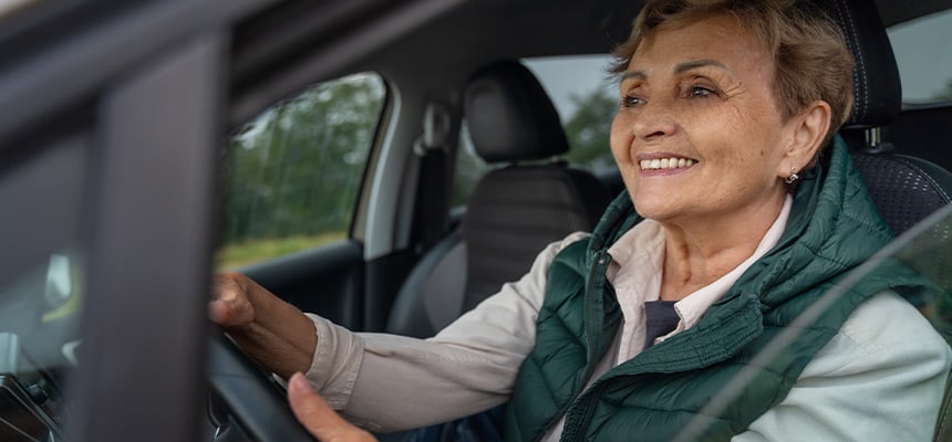 Older woman in a car driving