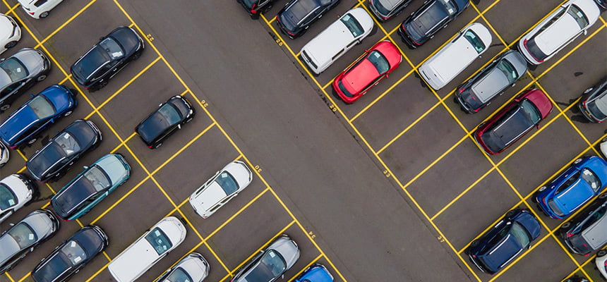 overhead view of parking lot with cars