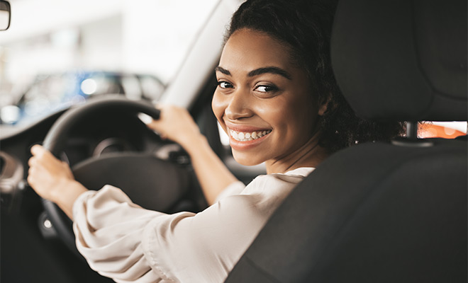 woman smiling in car