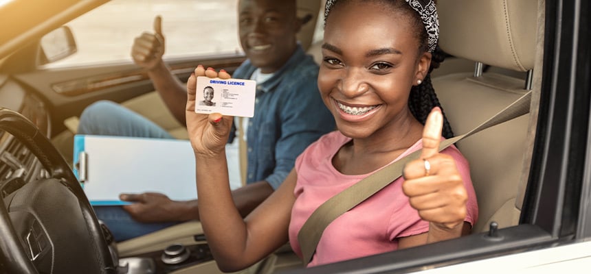 Teen holding a learners permit
