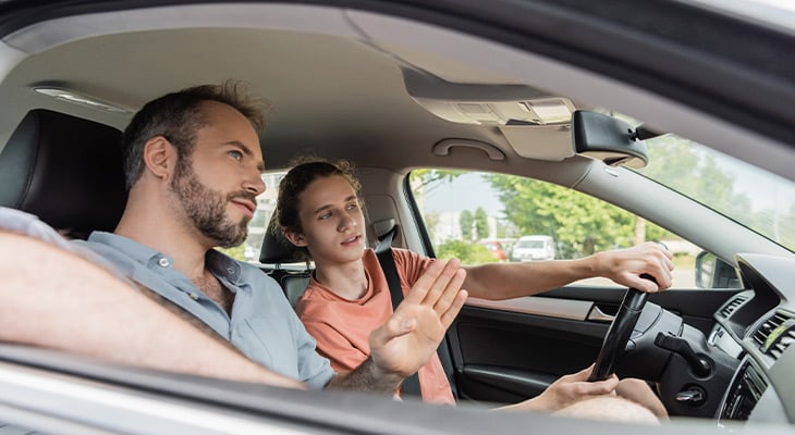 Parent lecturing teen driver